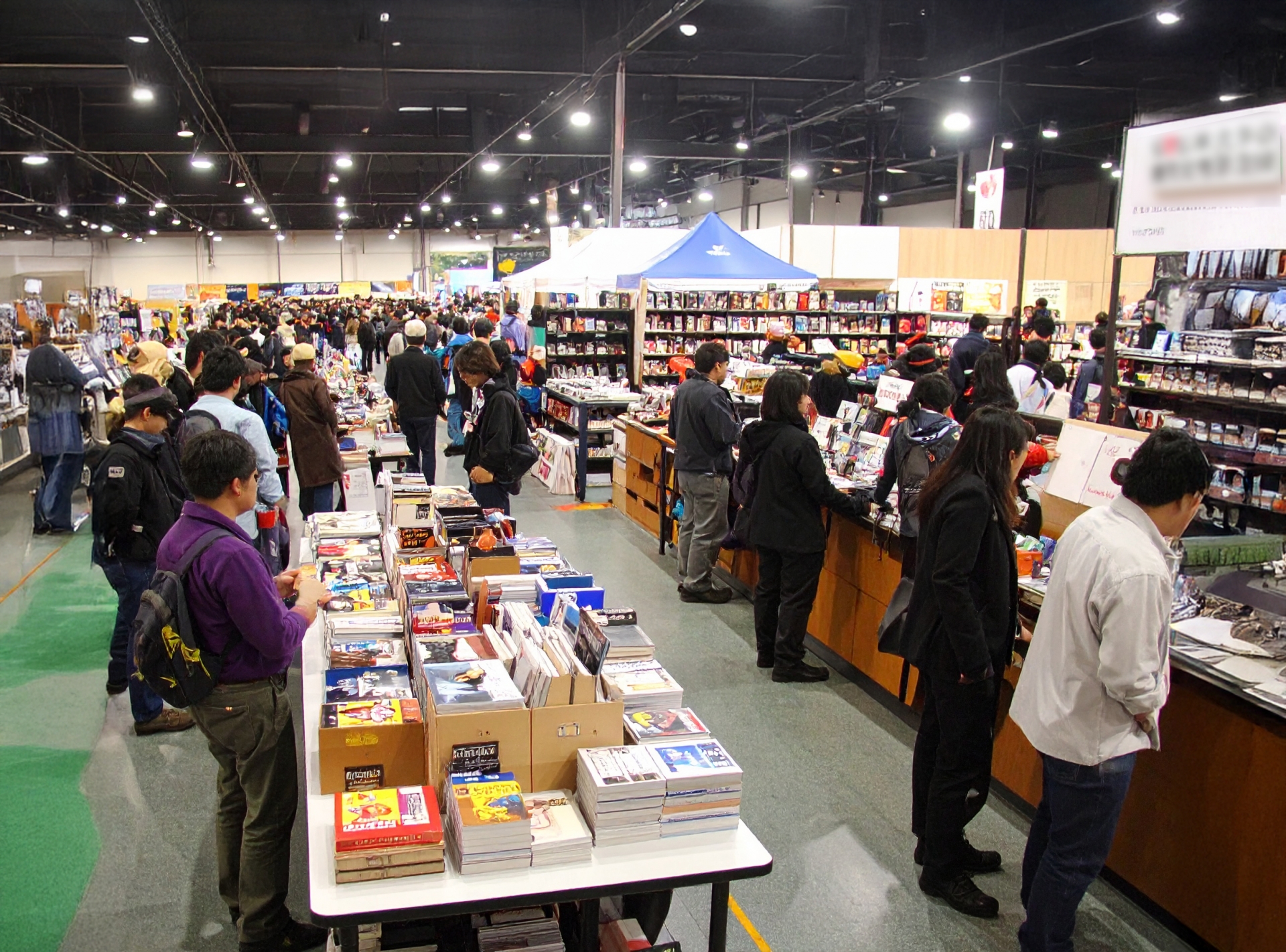 Crowds browsing doujin works at a large Japanese fan convention