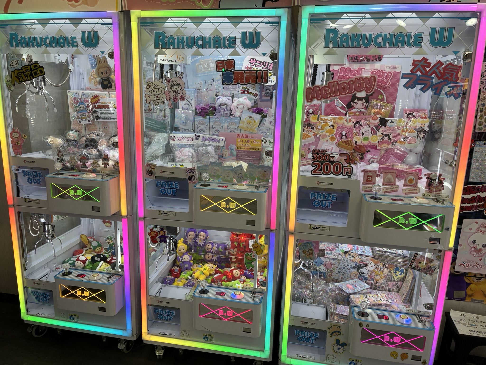 Collectible figures displayed in a second-hand shop showcase in Nipponbashi